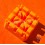 Bloc support plastique orange pour réparation bracelet montre horlogerie